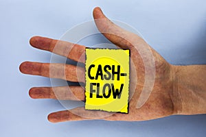 Handwriting text Cash-Flow. Concept meaning Virtual movement of money by company finance department statistics written on Yellow S