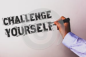 Handwriting text Challenge Yourself. Concept meaning Overcome Confidence Strong Encouragement Improvement Dare Advisors hand holdi