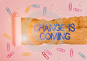 Handwriting text Change Is Coming. Concept meaning telling someone that future going to be different Paper clip and torn