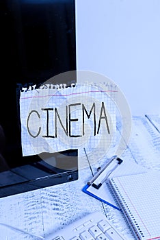Handwriting text Cinema. Concept meaning theater where movies are shown for public entertainment Movie theater Note paper taped to