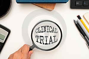 Handwriting text Clinical Trial. Business showcase trials to evaluate the effectiveness and safety of medication Office