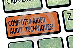 Handwriting text Computer Aided Audit Techniques. Concept meaning Using computer to automate IT audit process Keyboard key