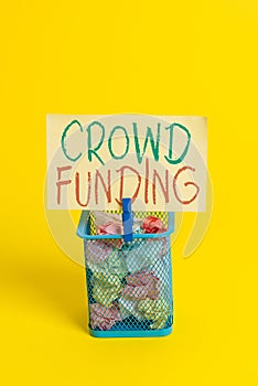 Handwriting text Crowd Funding. Concept meaning Fundraising Kickstarter Startup Pledge Platform Donations Trash bin