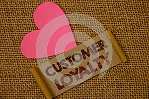 Handwriting text Customer Loyalty. Concept meaning Client Satisfaction Long-Term relation Confidence Ideas on old vintage paper bl photo