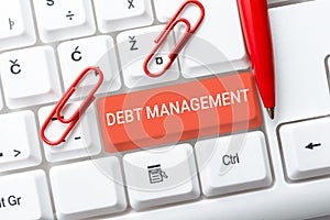 Handwriting text Debt Management. Business concept The formal agreement between a debtor and a creditor Transcribing