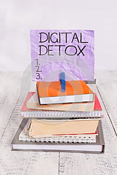 Handwriting text Digital Detox. Concept meaning Free of Electronic Devices Disconnect to Reconnect Unplugged pile stacked books