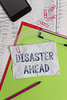 Handwriting text Disaster Ahead. Concept meaning Contingency Planning Forecasting a disaster or incident Clipboard paper