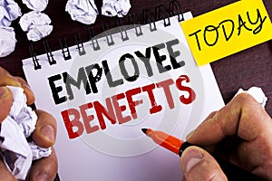 Handwriting text Employee Benefits. Concept meaning list of advantage recruiter get at work Insurance written by Man on Notepad on