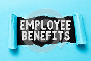 Handwriting text Employee Benefits. Internet Concept indirect and noncash compensation paid to an employee Tear on sheet