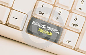 Handwriting text Employee Referral Program. Concept meaning employees recommend qualified friends relatives White pc