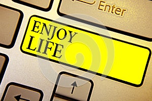 Handwriting text Enjoy Life. Concept meaning Any thing, place,food or person, that makes you relax and happy Keyboard yellow key I