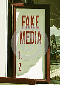 Handwriting text Fake Media. Concept meaning An formation held by brodcasters which we cannot rely on Empty white board photo