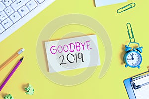 Handwriting text Goodbye 2019. Concept meaning expressing good wishes during parting at the end of the year Flat lay