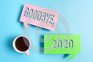 Handwriting text Goodbye 2020. Concept meaning New Year Eve Milestone Last Month Celebration Transition Paper accesories photo