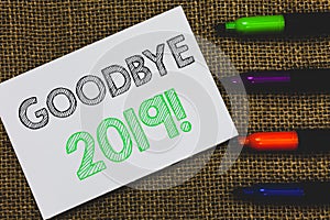 Handwriting text Goodbye 2019. Concept meaning New Year Eve Milestone Last Month Celebration Transition White Paper photo