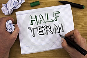 Handwriting text Half Term. Concept meaning Short holiday in the middle of the periods school year is divided. Concept For Informa photo