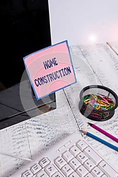 Handwriting text Home Construction. Concept meaning the process of constructing a living accommodation Note paper taped to black