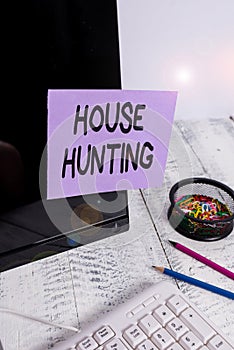 Handwriting text House Hunting. Concept meaning the act of searching or looking for a house to buy or rent Note paper taped to