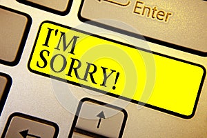 Handwriting text I am Sorry. Concept meaning To ask for forgiveness to someone you unintensionaly hurt Keyboard yellow key Intenti photo