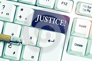 Handwriting text Justice. Concept meaning impartial adjustment of conflicting claims or assignments White pc keyboard