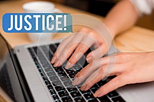 Handwriting text Justice. Concept meaning impartial adjustment of conflicting claims or assignments woman laptop
