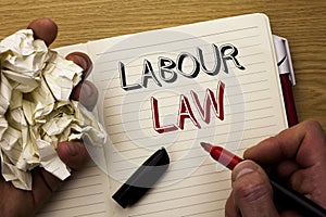 Handwriting text Labour Law. Concept meaning Employment Rules Worker Rights Obligations Legislation Union written by Man on Notebo