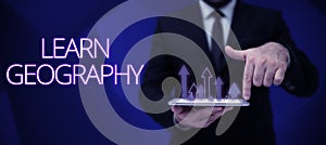 Handwriting text Learn Geographystudy of physical features of earth and its atmosphere. Business concept study of