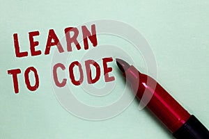 Handwriting text Learn To Code. Concept meaning Learn to write Software Be a Computer Programmer Coder Open red marker intention c