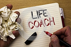 Handwriting text Life Coach. Concept meaning Mentoring Guiding Career Guidance Encourage Trainer Mentor written by Man on Notebook