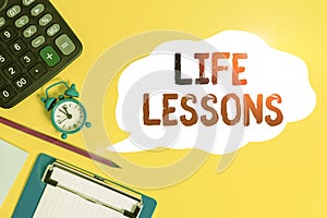 Handwriting text Life Lessons. Concept meaning something which useful knowledge or principles can be learned Alarm clock wakeup photo