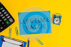 Handwriting text Lifetime Value. Concept meaning Worth of the customer over the lifetime of the business Clipboard sheet