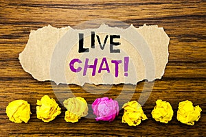 Handwriting text Live Chat . Concept for Communication Livechat Written on sticky note paper reminder, wooden background with st photo