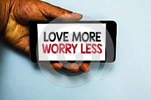 Handwriting text Love More Worry Less. Concept meaning Have a good attitude motivation be lovable enjoy life Human hand