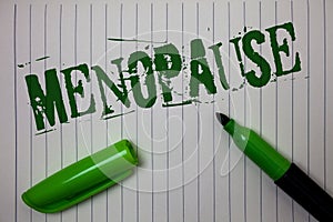 Handwriting text Menopause. Concept meaning Cessation of menstruation Older women hormonal changes period Linned paper background