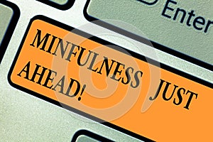 Handwriting text Mindfulness Just Ahead. Concept meaning training your mind to concentrate on the present Keyboard key