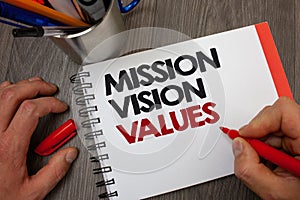 Handwriting text Mission Vison Values. Concept meaning planning for future improvement Career Right decisions Notepad pen informat