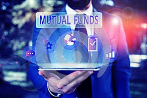 Handwriting text Mutual Funds. Concept meaning An investment program funded by shareholders Individual Stocks Male human wear