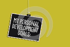 Handwriting text My Personal Development Goals. Concept meaning Desires Wishes Career Business planning Hanging blackboard message