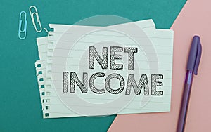 Handwriting text Net Income. Business overview the gross income remaining after all deductions and exemptions are taken