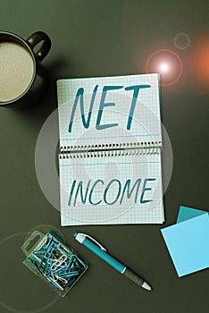 Handwriting text Net Income. Concept meaning the gross income remaining after all deductions and exemptions are taken