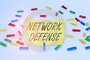 Handwriting text Network Defense. Concept meaning easures to protect and defend information from disruption Colored clothespin