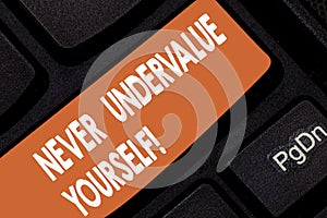 Handwriting text Never Undervalue Yourself. Concept meaning Certainly not underestimate your real worth Keyboard key Intention to