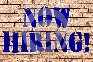 Handwriting text Now Hiring. Concept meaning Workforce Wanted Employees Recruitment Brick Wall art like Graffiti