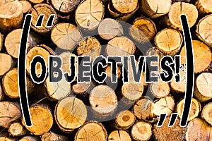 Handwriting text Objectives. Concept meaning Goals planned to be achieved Desired targets Wooden background vintage wood wild