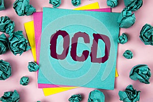 Handwriting text Ocd. Concept meaning Obsessive Compulsive Disorder Psychological Illness Medical Condition written on Sticky Note