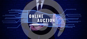 Handwriting text Online Auction. Concept meaning digitized sale event which item is sold to the highest bidder