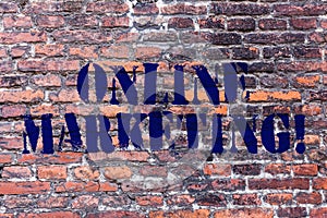 Handwriting text Online Marketing. Concept meaning leveraging web based channels spread about companys brand Brick Wall
