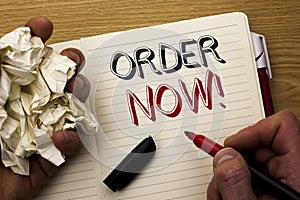 Handwriting text Order Now. Concept meaning Buy Purchase Order Deal Sale Promotion Shop Product Register written by Man on Noteboo