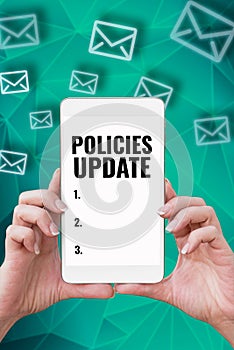 Handwriting text Policies Update. Business concept act of adding new information or guidelines formulated