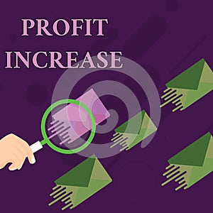 Handwriting text Profit Increase. Concept meaning the growth in the amount of revenue gained from a business Magnifying